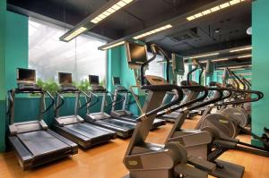 a row of treadmills in a gym at Hilton Chongqing in Chongqing