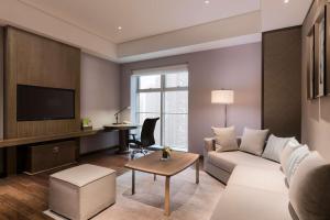 Televízia a/alebo spoločenská miestnosť v ubytovaní DoubleTree by Hilton Hotel Shiyan