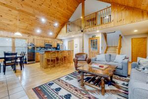 a living room with a couch and a table at Beaver Glen in Vermont Ventures