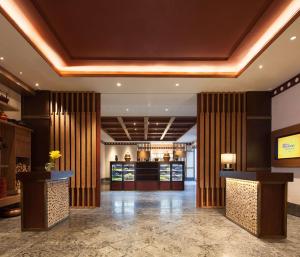 a lobby of a hotel with a bar in it at Hilton Garden Inn Shangri-La in Shangri-La