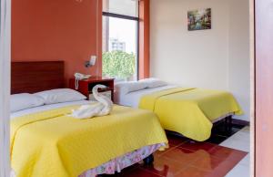 Voodi või voodid majutusasutuse Hostal Antares toas