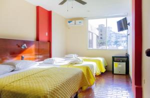 Voodi või voodid majutusasutuse Hostal Antares toas