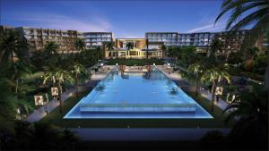 an overhead view of a resort pool with palm trees at Doubletree Resort By Hilton Hainan - Xinglong Lakeside in Wanning