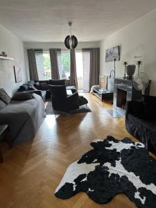 a living room with a couch and a fireplace at Pråmkanalens Pensionat i Karlstad in Karlstad