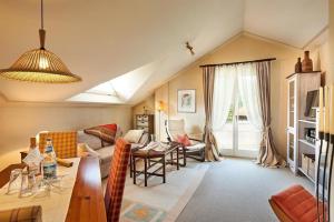 a living room with a couch and a table at Ferienvilla Gaisser in Bad Hindelang