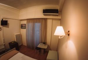 TV a/nebo společenská místnost v ubytování Hotel King Pyrros