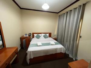 Postel nebo postele na pokoji v ubytování Al Jazeerah Hotel + 27 fotografií