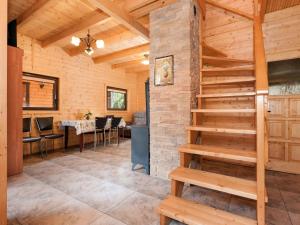 a staircase in a room with a table and chairs at Holiday Resort in Pobierowo for 6 persons in Pobierowo