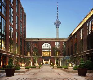 a view of a building with a tv tower in the background at Conrad Tianjin in Tianjin