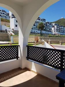 a balcony with an archway with a view of a building at Cabo negro bella vista in Fez