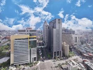 an aerial view of a city with tall buildings at Hilton Taipei Sinban in Taipei