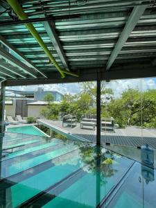 a swimming pool with blue water in a building at Luxury Villa Cañadas in Guadalajara