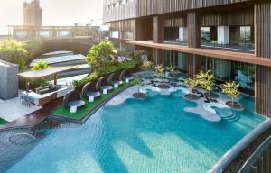 an overhead view of a building with a swimming pool at Hilton Pattaya in Pattaya Central