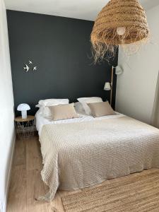 Posteľ alebo postele v izbe v ubytovaní La cale du bord de mer