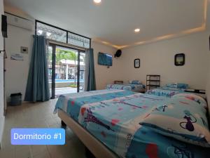 Säng eller sängar i ett rum på Casa Halley #2 con vista al mar , Playas
