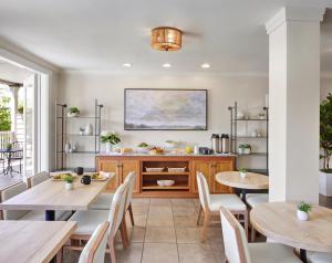 a dining room with two tables and a buffet at Inn at Sonoma, A Four Sisters Inn in Sonoma