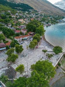 an aerial view of a beach with trees and water at Welcome Guest House in Shkodër