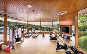 an image of a gym with treadmills and ellipticals at DoubleTree by Hilton Goa - Panaji in Panaji