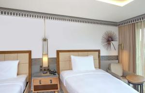 DoubleTree by Hilton Goa - Panaji客房内的一张或多张床位