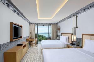 DoubleTree by Hilton Goa - Panaji客房内的一张或多张床位