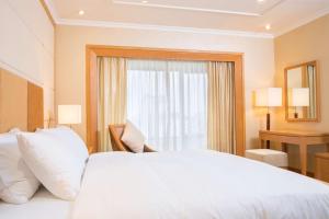 Postel nebo postele na pokoji v ubytování Hilton Garden Inn Hanoi