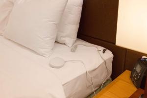 Postel nebo postele na pokoji v ubytování Hilton Garden Inn Hanoi