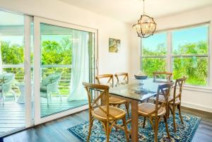 a dining room with a table and chairs at Henderson home in Sanibel