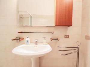 a bathroom with a sink and a mirror at Borgo A Lago in Rezzonico