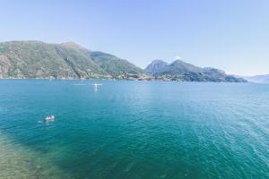 an aerial view of a large body of water with a boat at Borgo A Lago in Rezzonico