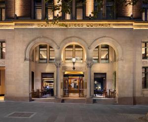 a building with the entrance to a business center at Hilton Melbourne Little Queen Street in Melbourne