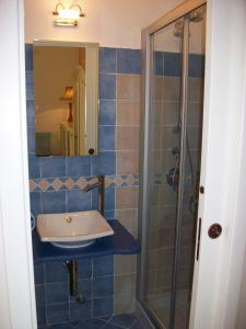 a bathroom with a sink and a shower at Dorotea Studio in Lipari