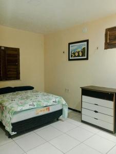 Katil atau katil-katil dalam bilik di Casa em Paracuru Beach