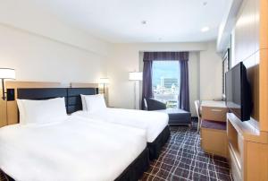 TV a/nebo společenská místnost v ubytování DoubleTree by Hilton Naha