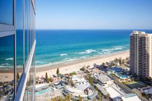 a view of a beach and the ocean from a building at Hilton Surfers Paradise Hotel & Residences in Gold Coast