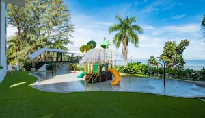 a childrens playground with a slide and a water park at DoubleTree Resort by Hilton Hotel Penang in Batu Ferringhi