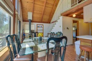 a dining room with a glass table and chairs at Quiet 1 BR and Loft Home about 6 Mi to Yosemite in Groveland