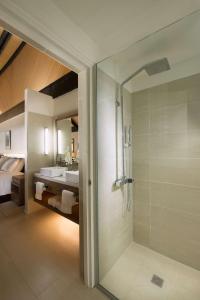 a bathroom with a shower and a sink at DoubleTree by Hilton Fiji - Sonaisali Island in Nadi
