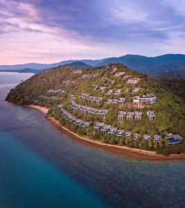 an aerial view of an island in the water at Conrad Koh Samui in Taling Ngam Beach