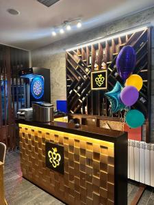 a bar in a restaurant with balloons and balloons at Luxury Apartments 88 in Smederevo