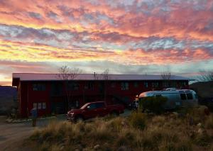 a red truck parked in front of a red building at Studio 203 in Clarkdale