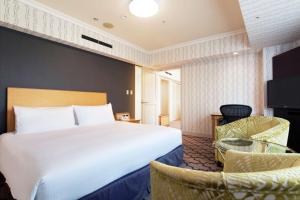Postel nebo postele na pokoji v ubytování Hilton Tokyo Narita Airport