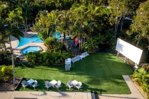 an aerial view of a lawn with chairs and a pool at Solitary Islands Resort in Wooli