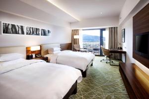 Postel nebo postele na pokoji v ubytování Hilton Gyeongju