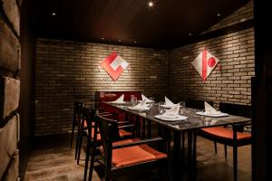 a dining room with a long table and chairs at Hilton Nagasaki in Nagasaki