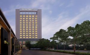 a tall building with a lot of windows on it at DoubleTree by Hilton-Pune Chinchwad in Pune
