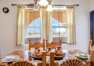 a dining room with a table and a large window at San Felipe Beach Rental Condo 71-2 in San Felipe