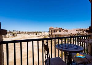a balcony with a table and chairs and a view of the beach at San Felipe Beach Rental Condo 71-2 in San Felipe