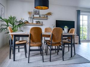 Holiday home Bindslev XVI的电视和/或娱乐中心