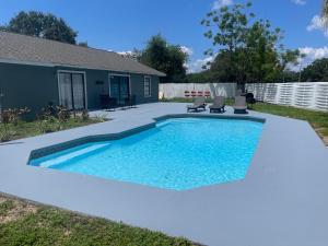 a swimming pool in the backyard of a house at The Cozy spot in Orlando