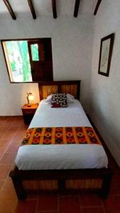 Ένα ή περισσότερα κρεβάτια σε δωμάτιο στο la casita de los viajeros